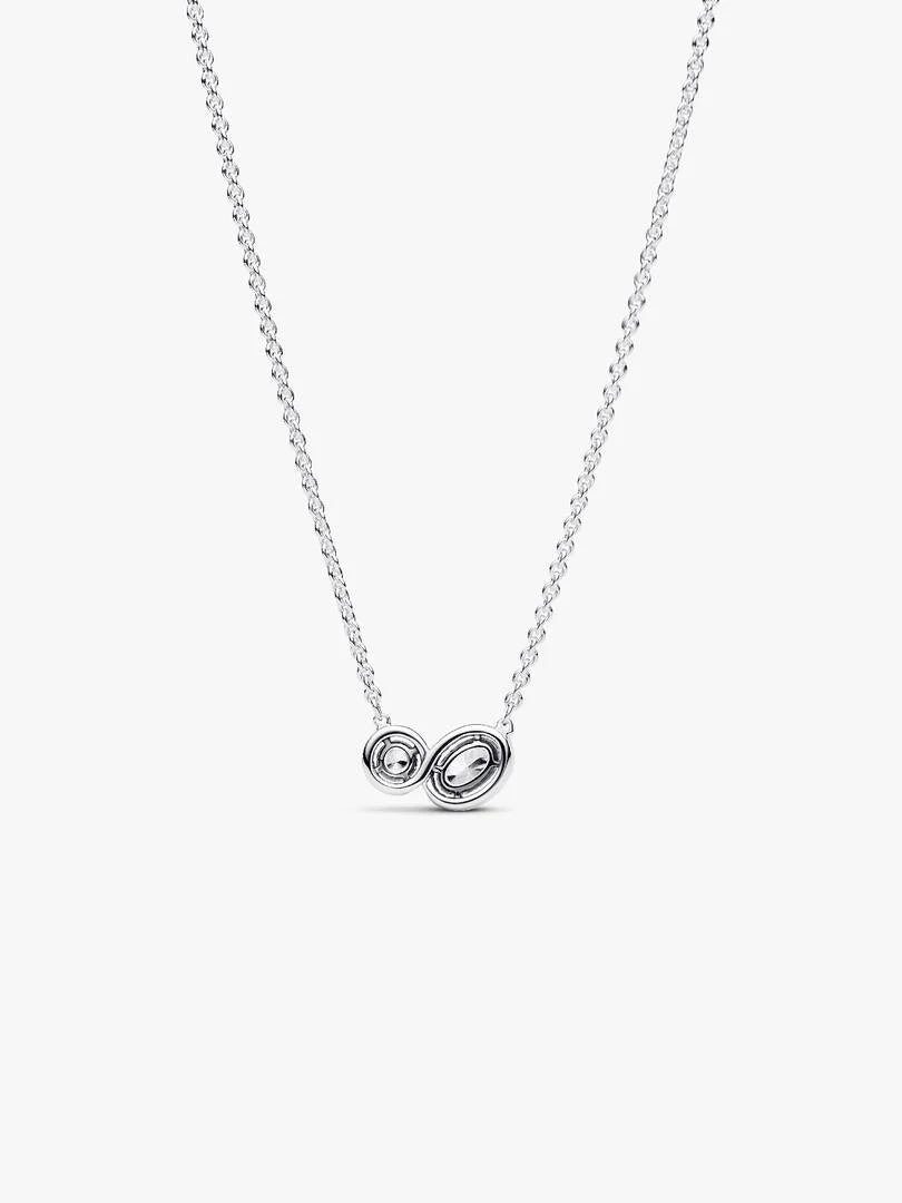 Silver necklace with a unique pendant on a white background