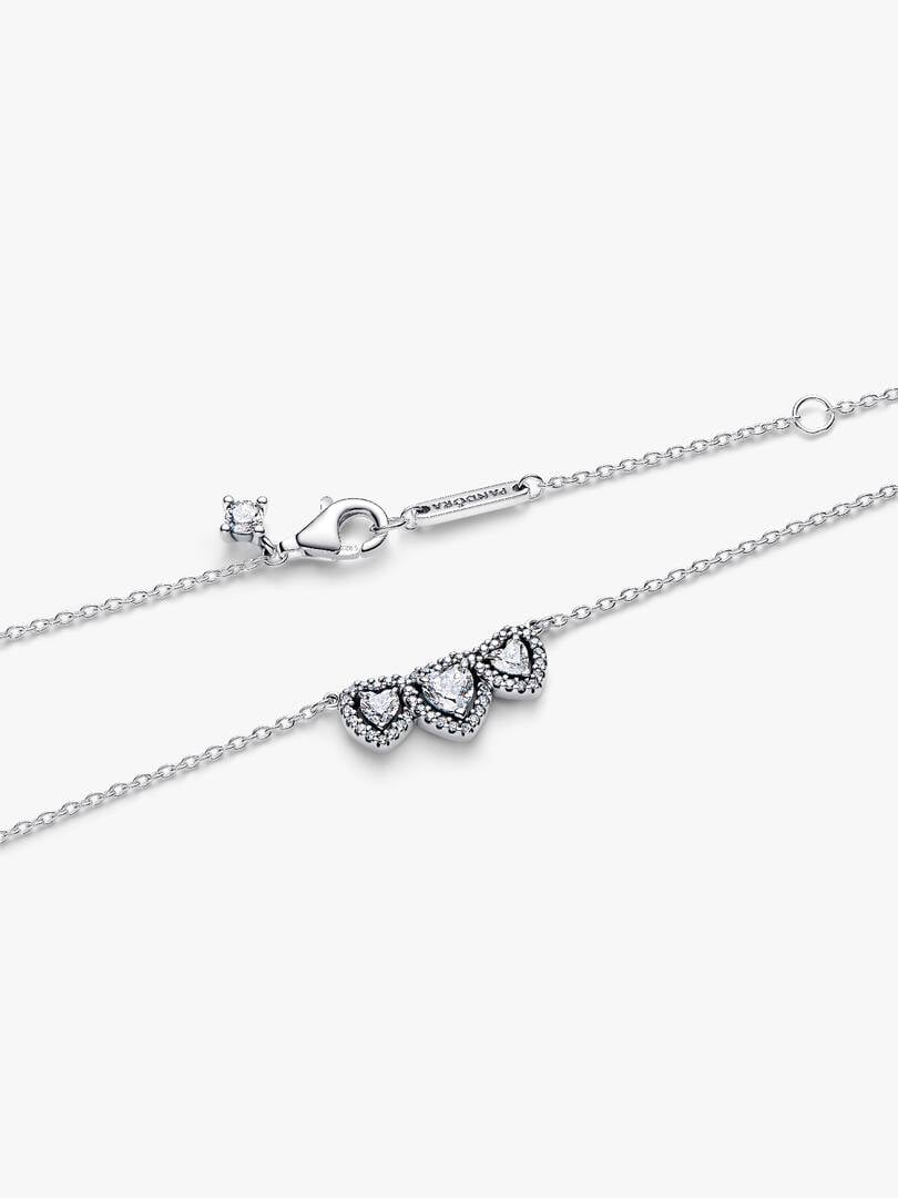 Silver necklace with heart-shaped pendants on a white background