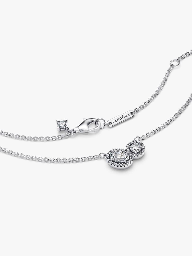 Silver necklace with a clasp on a white background