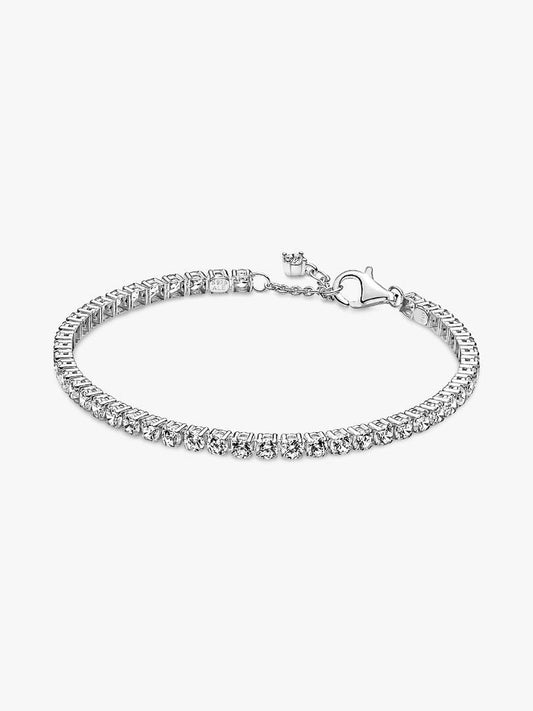 Silver bracelet with small zirconia against a neutral background