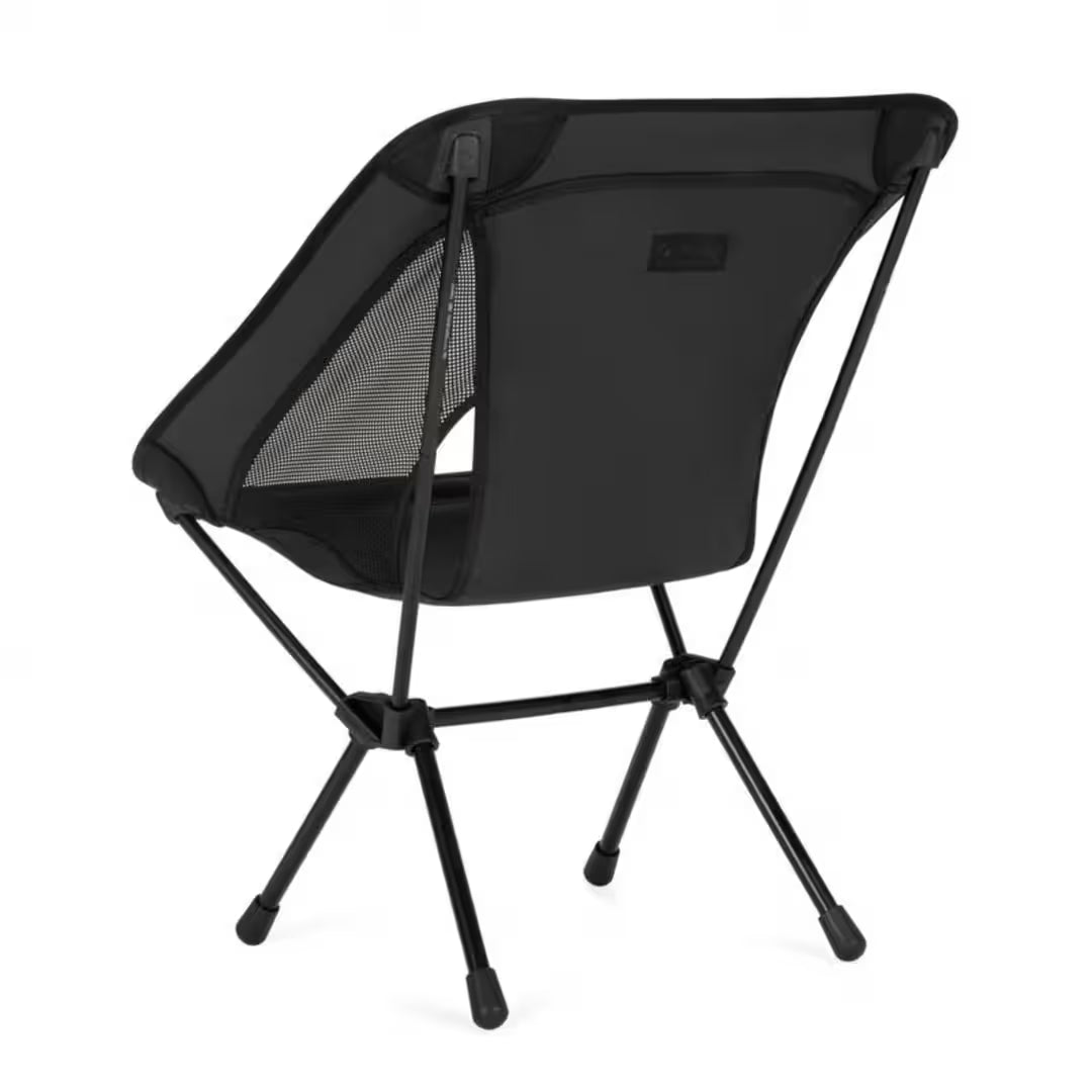 Black camping chair with mesh back on a white background
