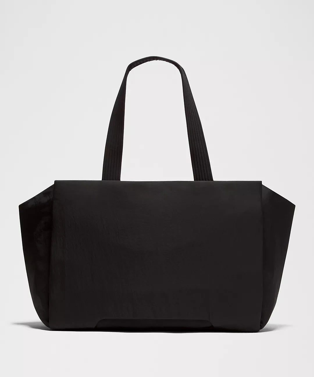 Black tote bag on a light gray background