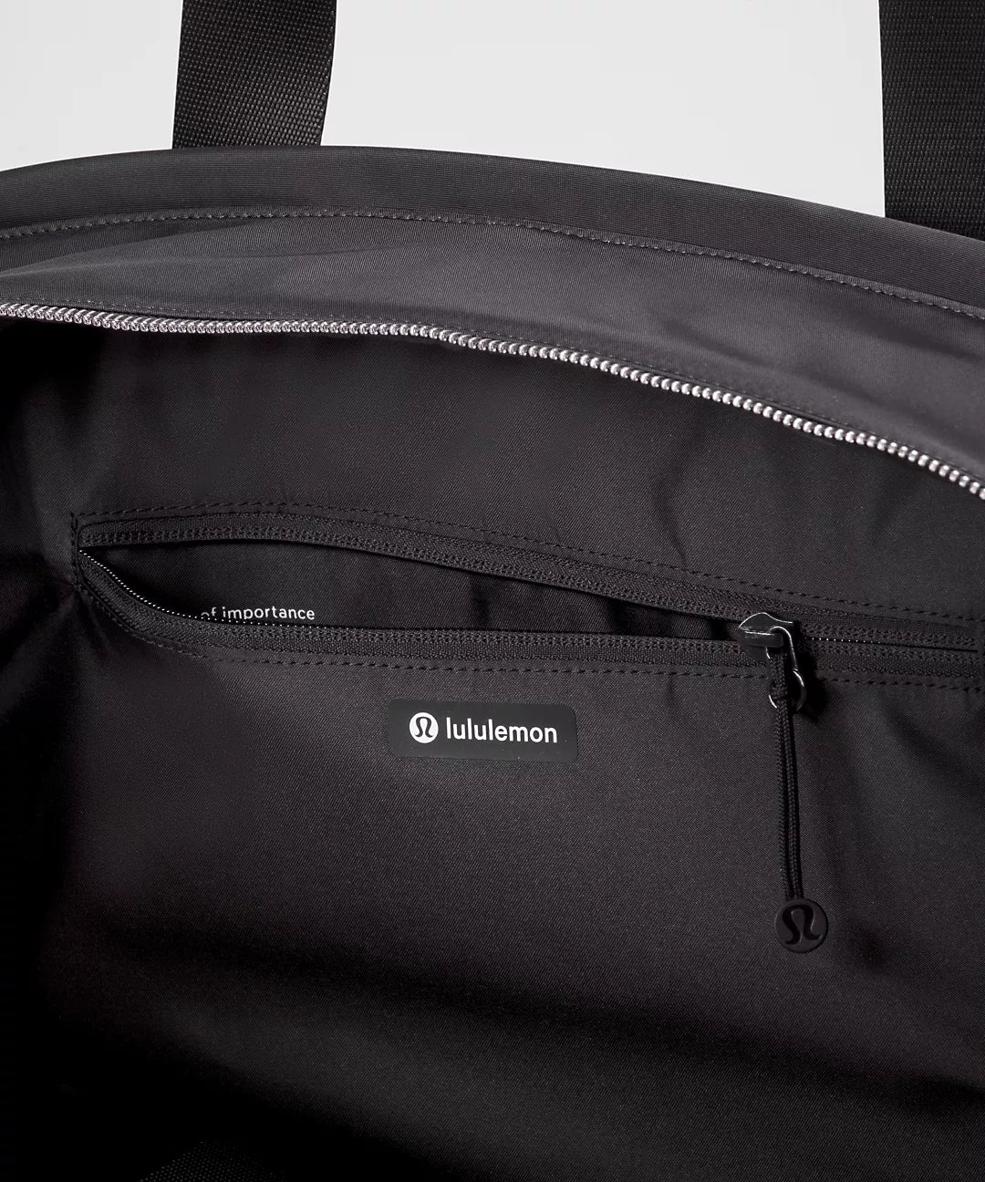 Black bag with Lululemon logo on a white background
